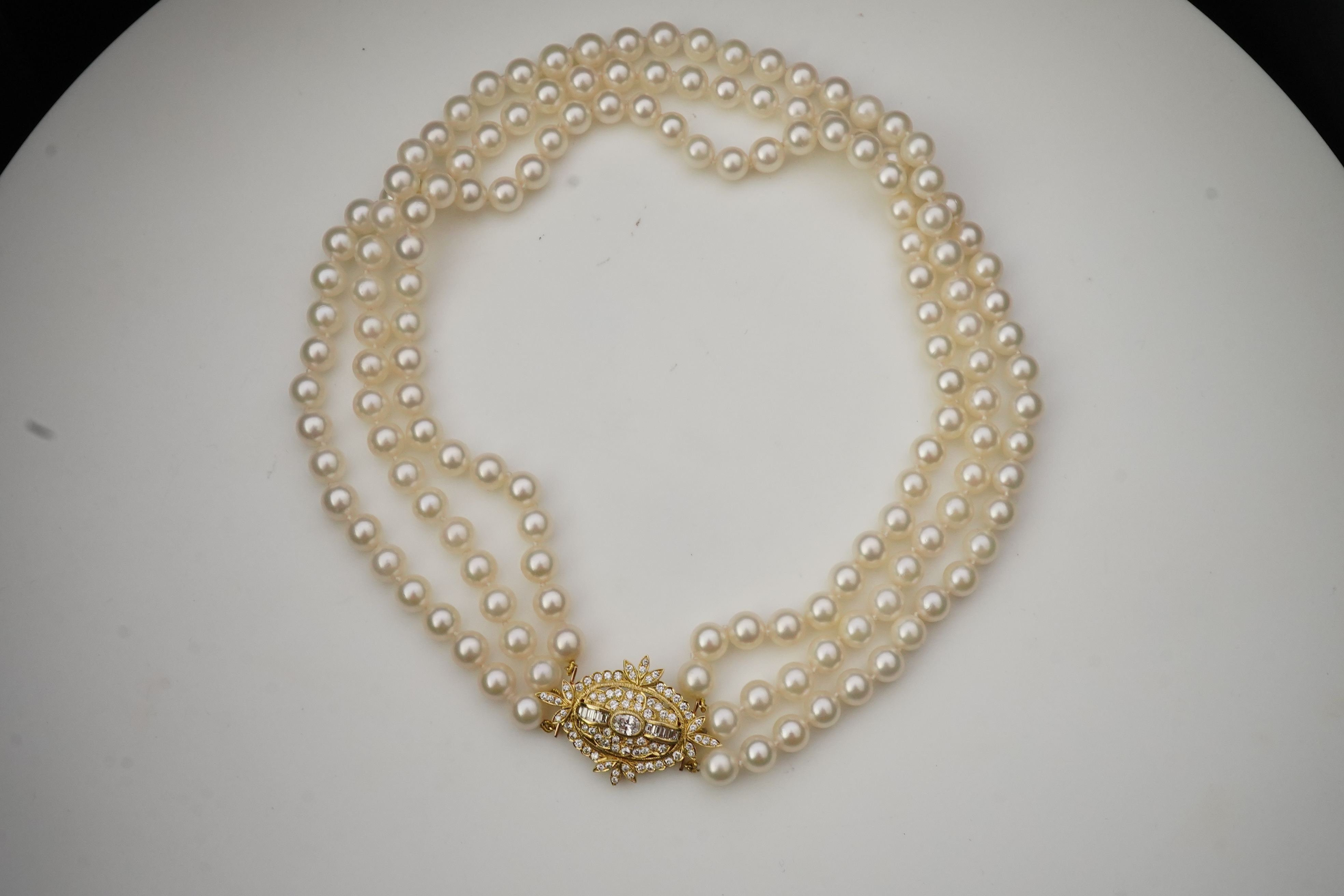 A cultured pearl and diamond necklace/brooch